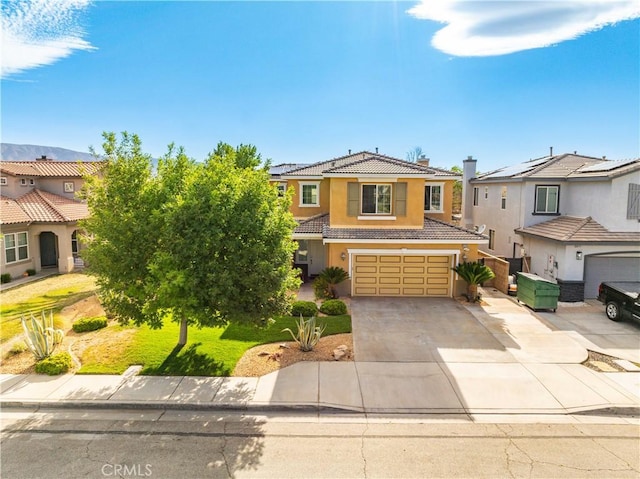 43145 62nd St W, Lancaster, CA 93536 - view of front of home featuring a tile roof, stucco siding, an attached garage, driveway, and a residential view