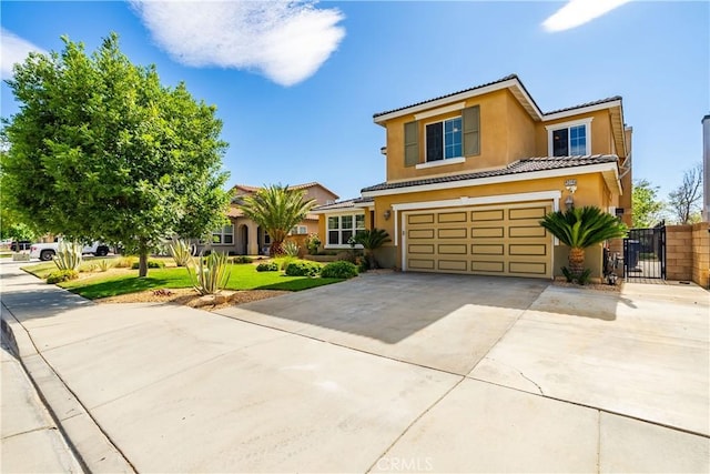 43145 62nd St W, Lancaster, CA 93536 - view of front of home with driveway, stucco siding, a tile roof, a garage, and a gate
