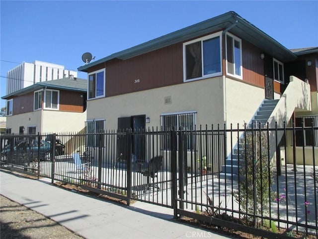 342346 W Palm St, Compton, CA 90220 - view of side of property featuring stucco siding and stairway