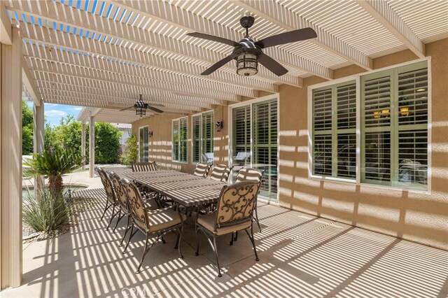 79787 Parkway Esplanade N, La Quinta, CA 92253 - view of patio with ceiling fan, a pergola, and outdoor dining area