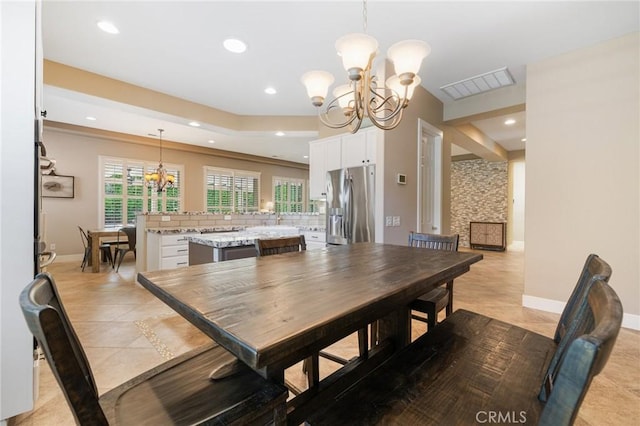 79787 Parkway Esplanade N, La Quinta, CA 92253 - dining room featuring a chandelier, light tile patterned floors, recessed lighting, and healthy amount of natural light