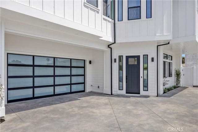 2102 Marshallfield Ln Unit B, Redondo Beach, CA 90278 - property entrance featuring board and batten siding, driveway, and a garage