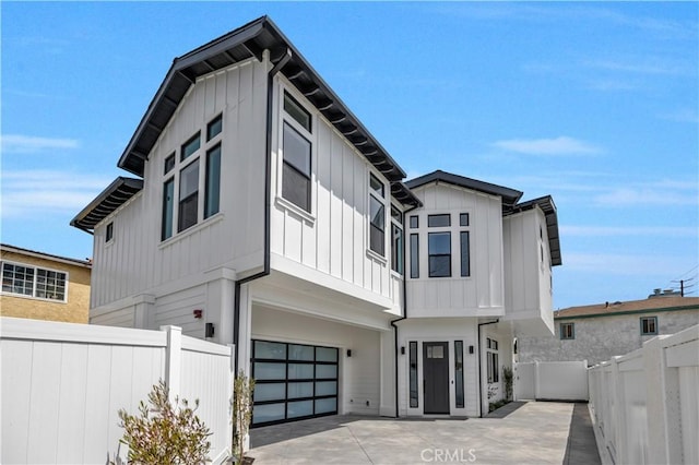 2102 Marshallfield Ln Unit B, Redondo Beach, CA 90278 - view of front of house with a garage, board and batten siding, and driveway
