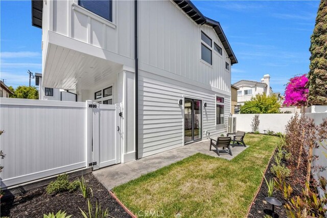 2102 Marshallfield Ln Unit B, Redondo Beach, CA 90278 - rear view of property with a gate, a fenced backyard, board and batten siding, and a patio
