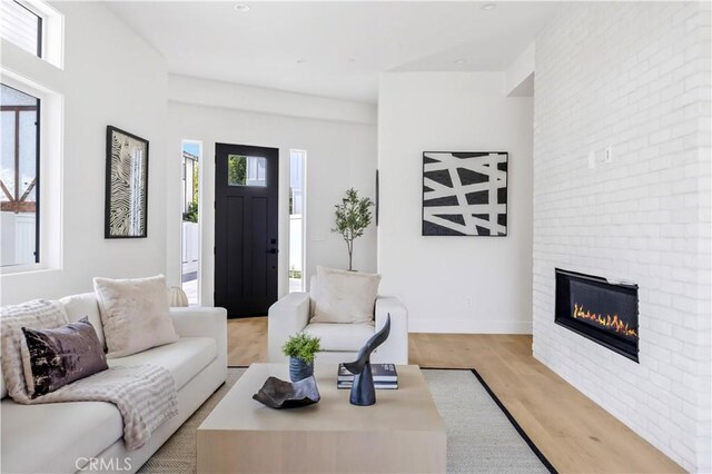 2102 Marshallfield Ln Unit B, Redondo Beach, CA 90278 - living room with a brick fireplace and light wood finished floors