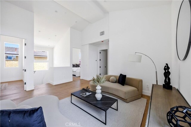 2102 Marshallfield Ln Unit B, Redondo Beach, CA 90278 - living room featuring wood finished floors and high vaulted ceiling