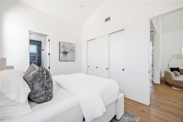 2102 Marshallfield Ln Unit B, Redondo Beach, CA 90278 - bedroom featuring light wood finished floors, lofted ceiling, and a closet