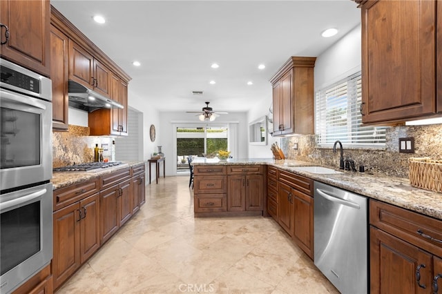 1907 W 235th Pl, Torrance, CA 90501 - kitchen with appliances with stainless steel finishes, recessed lighting, a ceiling fan, backsplash, and a peninsula