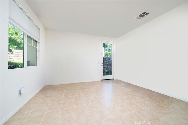 797 Plum Ln, Pomona, CA 91767 - empty room featuring healthy amount of natural light and light tile patterned flooring