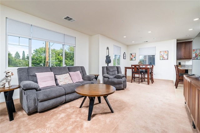 797 Plum Ln, Pomona, CA 91767 - living room featuring plenty of natural light, recessed lighting, and light colored carpet