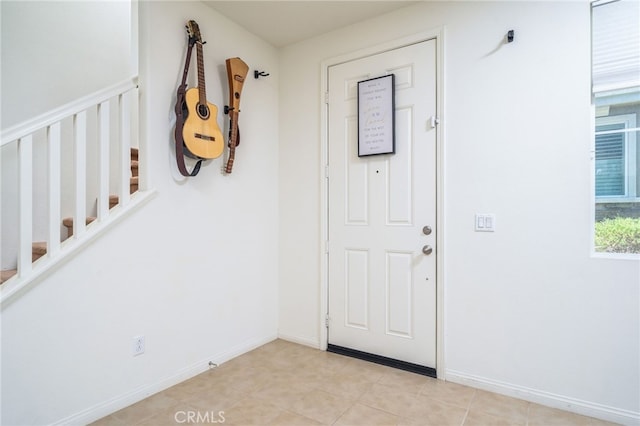 797 Plum Ln, Pomona, CA 91767 - foyer featuring stairs and baseboards
