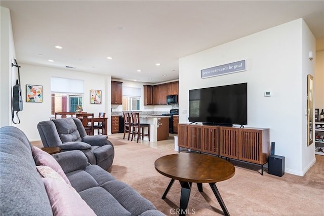 797 Plum Ln, Pomona, CA 91767 - living room with light carpet and recessed lighting