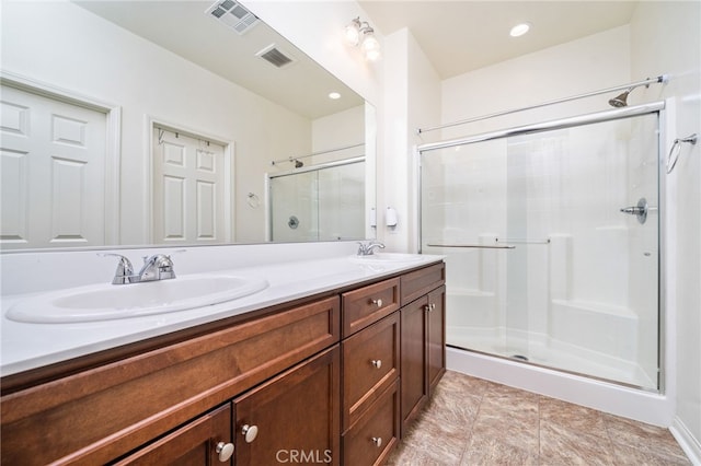 797 Plum Ln, Pomona, CA 91767 - bathroom with a stall shower and double vanity
