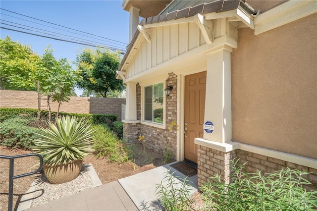 797 Plum Ln, Pomona, CA 91767 - view of exterior entry with board and batten siding and brick siding
