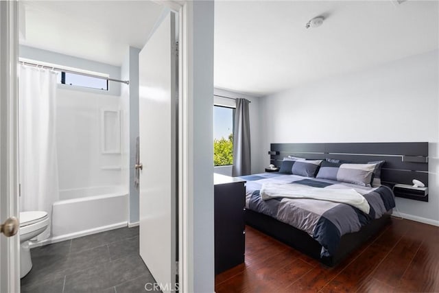 1237 E 6th St Unit 306, Long Beach, CA 90802 - bedroom with multiple windows and wood finished floors