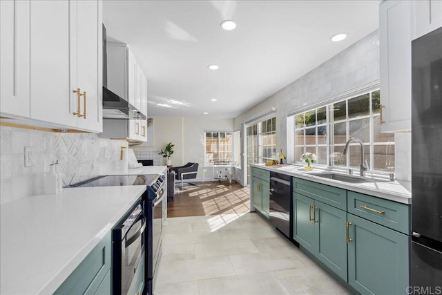 9858 Via Caceres, San Diego, CA 92129 - kitchen featuring green cabinets, dishwashing machine, range with electric stovetop, light countertops, and recessed lighting