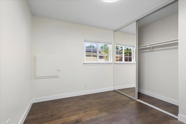 9858 Via Caceres, San Diego, CA 92129 - unfurnished bedroom with wood finished floors and a closet