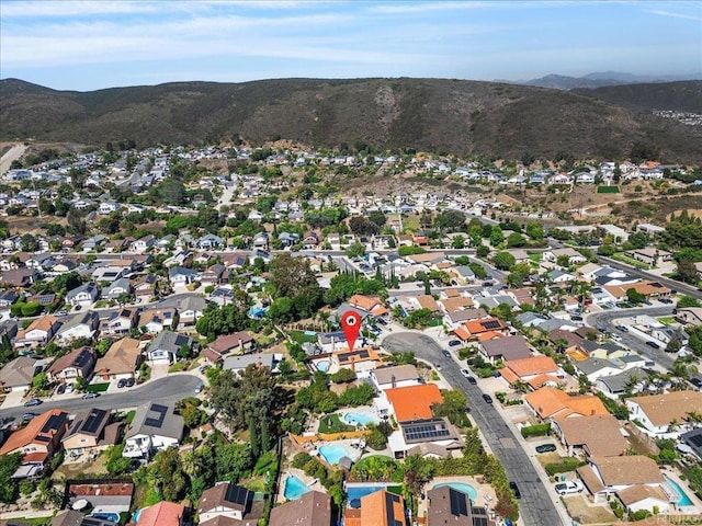 9858 Via Caceres, San Diego, CA 92129 - aerial overview of property's location featuring mountains and nearby suburban area