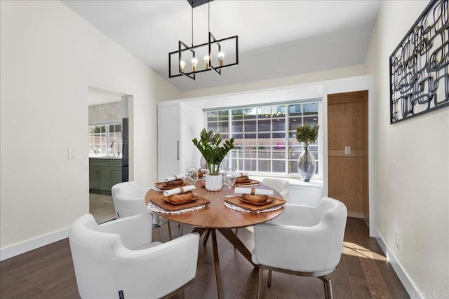 9858 Via Caceres, San Diego, CA 92129 - dining area featuring a chandelier, wood finished floors, and vaulted ceiling