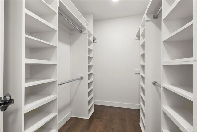9858 Via Caceres, San Diego, CA 92129 - spacious closet featuring dark wood-style flooring