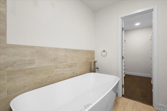 9858 Via Caceres, San Diego, CA 92129 - full bath with a freestanding tub and wood finished floors