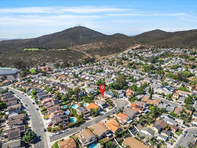 9858 Via Caceres, San Diego, CA 92129 - aerial overview of property's location featuring a mountainous background and nearby suburban area