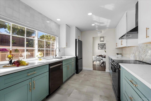 9858 Via Caceres, San Diego, CA 92129 - kitchen with black appliances, wall chimney range hood, white cabinets, light countertops, and tasteful backsplash
