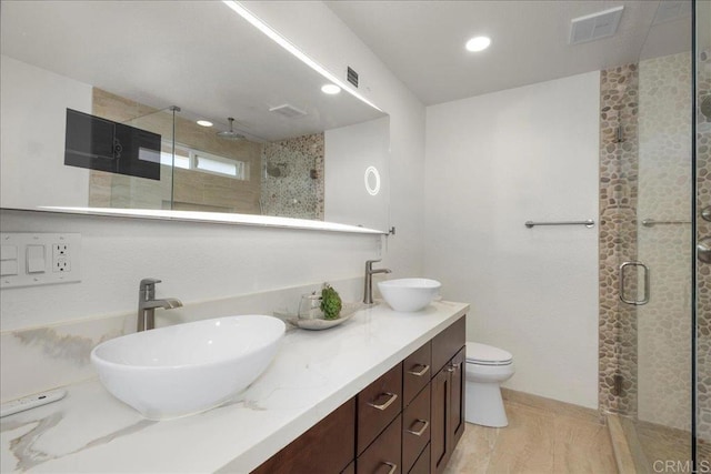 9858 Via Caceres, San Diego, CA 92129 - full bathroom featuring a stall shower, double vanity, and recessed lighting