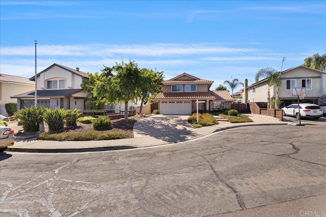 9858 Via Caceres, San Diego, CA 92129 - traditional-style home featuring driveway, a tile roof, a garage, and a residential view