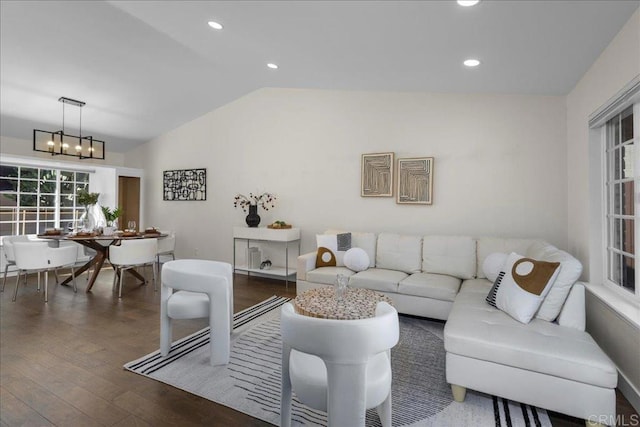 9858 Via Caceres, San Diego, CA 92129 - living room featuring vaulted ceiling, a chandelier, wood finished floors, and recessed lighting