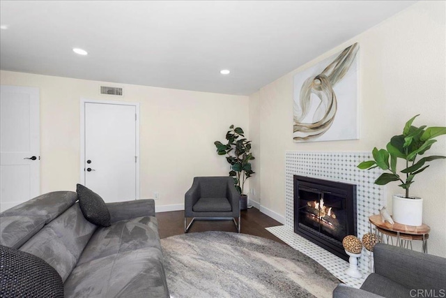 9858 Via Caceres, San Diego, CA 92129 - living room with a tile fireplace, recessed lighting, and wood finished floors