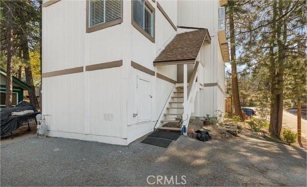 32490 Scandia Dr, Running Springs, CA 92382 - rear view of house featuring stairs and a shingled roof