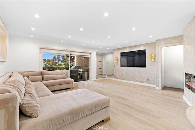 9436 Via Monique, Burbank, CA 91504 - living room featuring light wood finished floors, a glass covered fireplace, and recessed lighting
