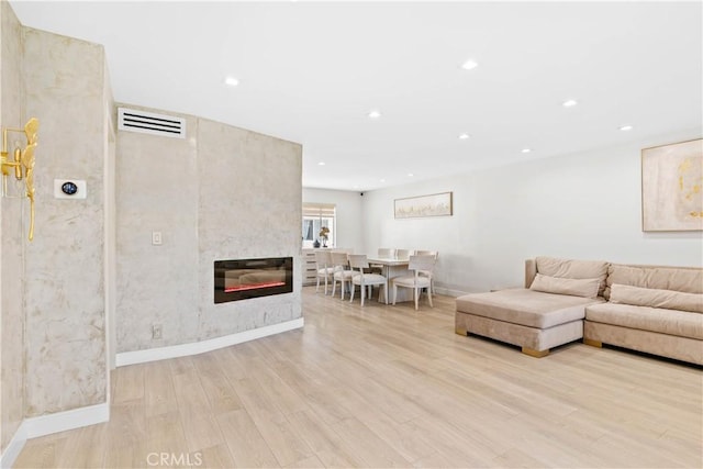 9436 Via Monique, Burbank, CA 91504 - living room featuring light wood-style flooring, recessed lighting, and a large fireplace