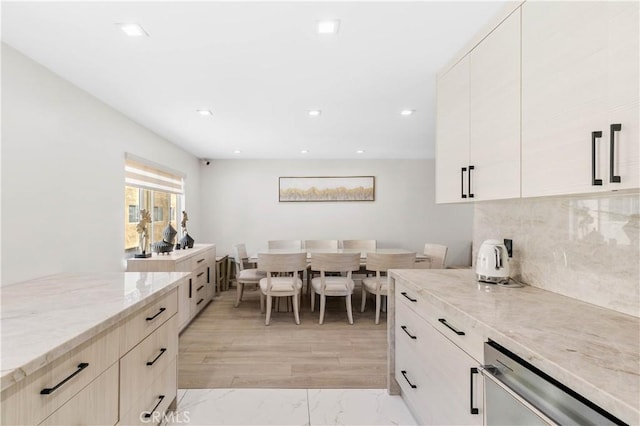 9436 Via Monique, Burbank, CA 91504 - kitchen featuring stainless steel dishwasher, light stone counters, decorative backsplash, recessed lighting, and modern cabinets