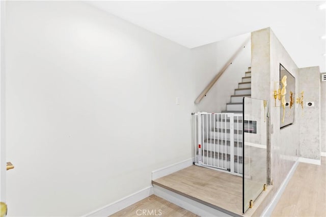 9436 Via Monique, Burbank, CA 91504 - staircase featuring wood finished floors and baseboards