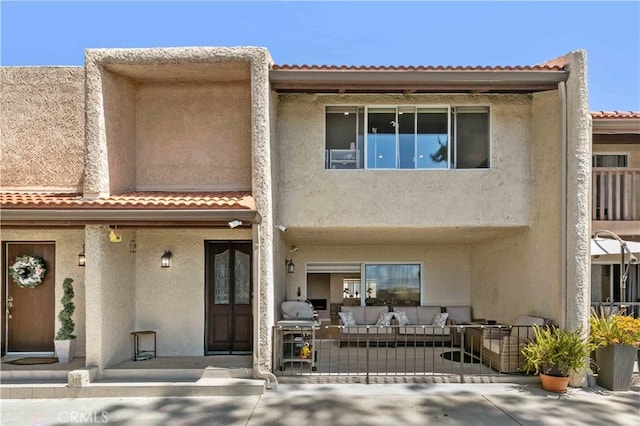 9436 Via Monique, Burbank, CA 91504 - view of front facade featuring stucco siding, a tile roof, and an outdoor living space