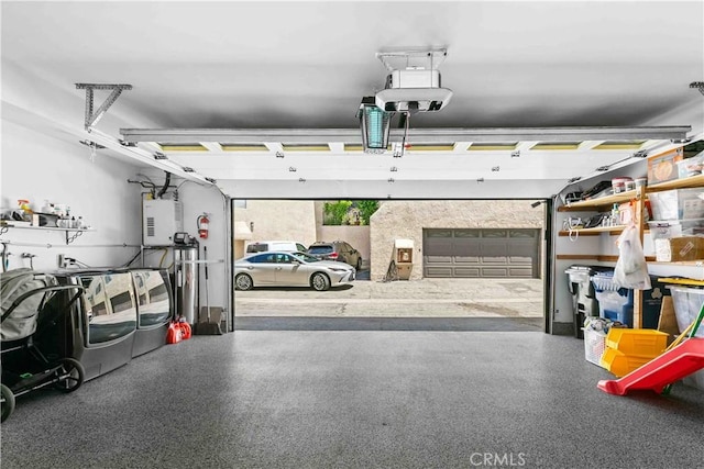 9436 Via Monique, Burbank, CA 91504 - garage featuring washing machine and dryer, a garage door opener, and water heater