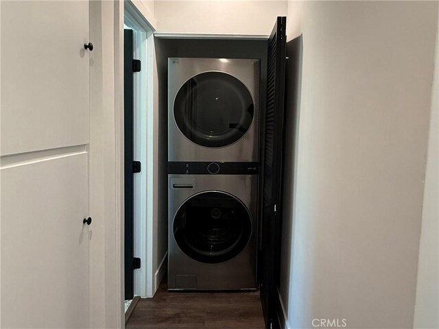 17532 Hamlin St, Lake Balboa, CA 91406 - laundry room with stacked washer / drying machine and wood finished floors