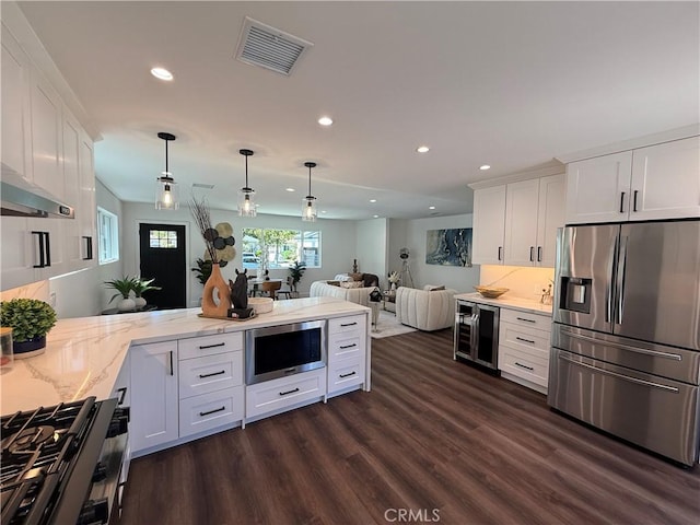 17532 Hamlin St, Lake Balboa, CA 91406 - kitchen featuring appliances with stainless steel finishes, beverage cooler, recessed lighting, a peninsula, and white cabinets