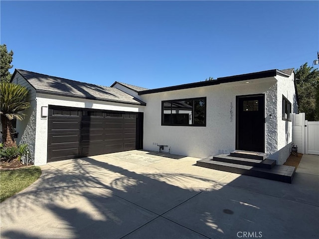 17532 Hamlin St, Lake Balboa, CA 91406 - view of front facade featuring entry steps, a garage, concrete driveway, and stucco siding