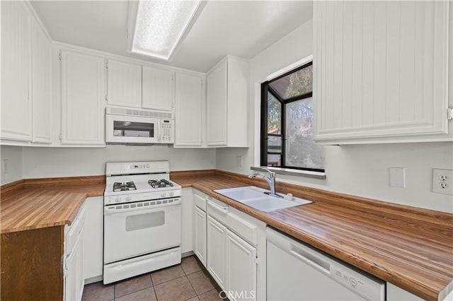 18165 Sundowner Way Unit 914, Canyon Country, CA 91387 - kitchen featuring white appliances, white cabinets, tile patterned floors, and butcher block countertops