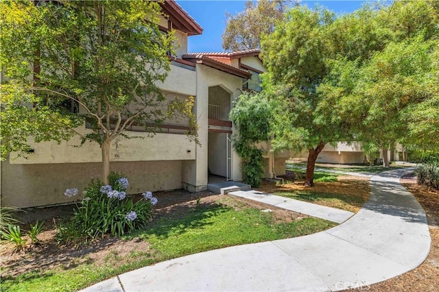 18165 Sundowner Way Unit 914, Canyon Country, CA 91387 - view of property exterior featuring stucco siding