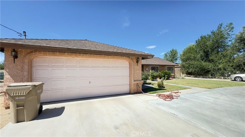 19077 Goleta St, Hesperia, CA 92345 - single story home with concrete driveway, an attached garage, stucco siding, and a front lawn
