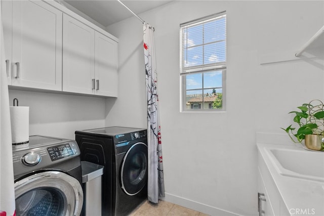 12062 Turnleaf Ave, Whittier, CA 90602 - laundry room featuring washing machine and dryer, cabinet space, and light tile patterned flooring