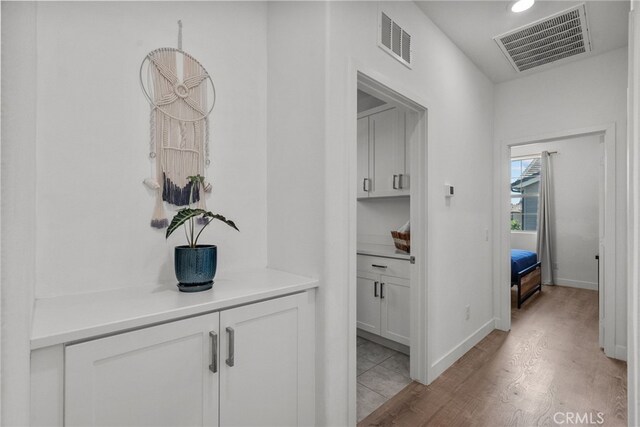 12062 Turnleaf Ave, Whittier, CA 90602 - hallway with light wood-style floors and recessed lighting