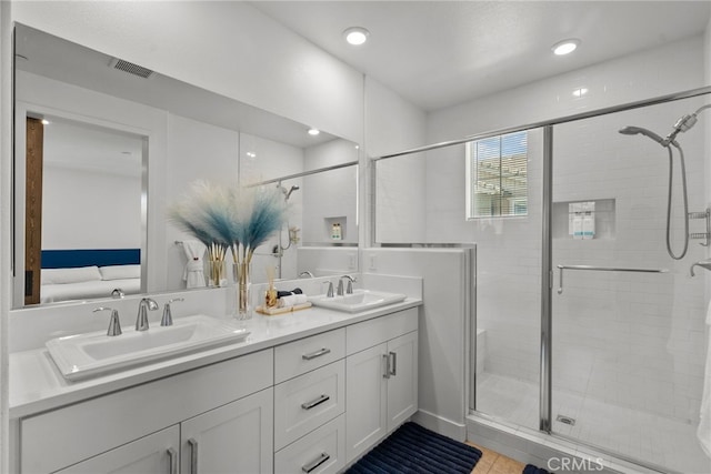 12062 Turnleaf Ave, Whittier, CA 90602 - full bath with double vanity, a stall shower, recessed lighting, and ensuite bath