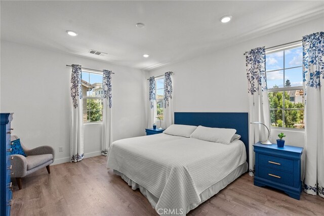 12062 Turnleaf Ave, Whittier, CA 90602 - bedroom featuring multiple windows, light wood finished floors, and recessed lighting