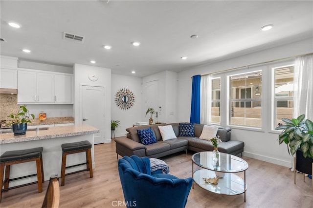 12062 Turnleaf Ave, Whittier, CA 90602 - living room featuring light wood-style flooring and recessed lighting