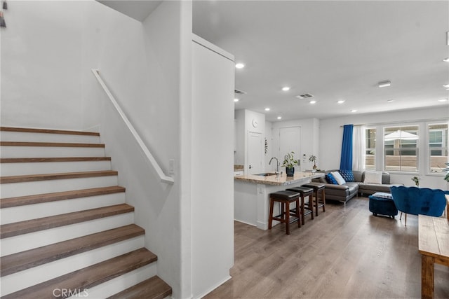 12062 Turnleaf Ave, Whittier, CA 90602 - stairway featuring recessed lighting and wood finished floors